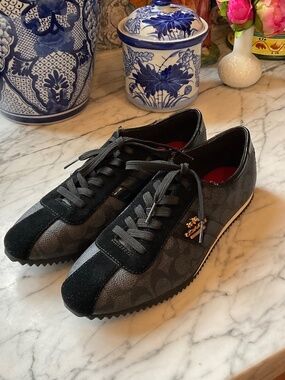 Like new Pair of Coach tennis shoes, black  never used, 8.5 m
